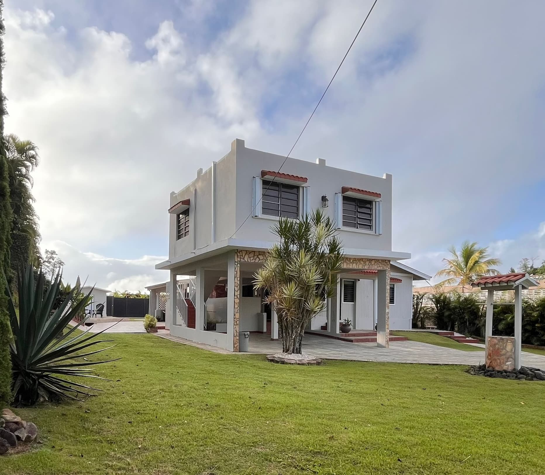 Vivian's Retreat exterior with lush green grounds