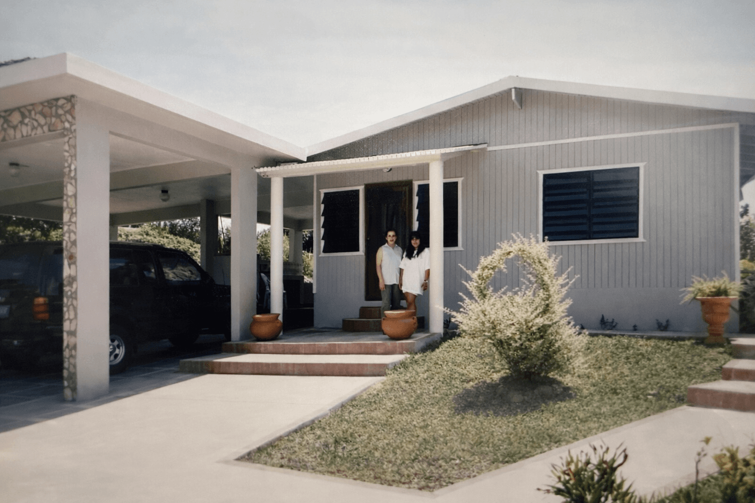 The house with its carport addition — showing progress over the years in Cidra, Puerto Rico